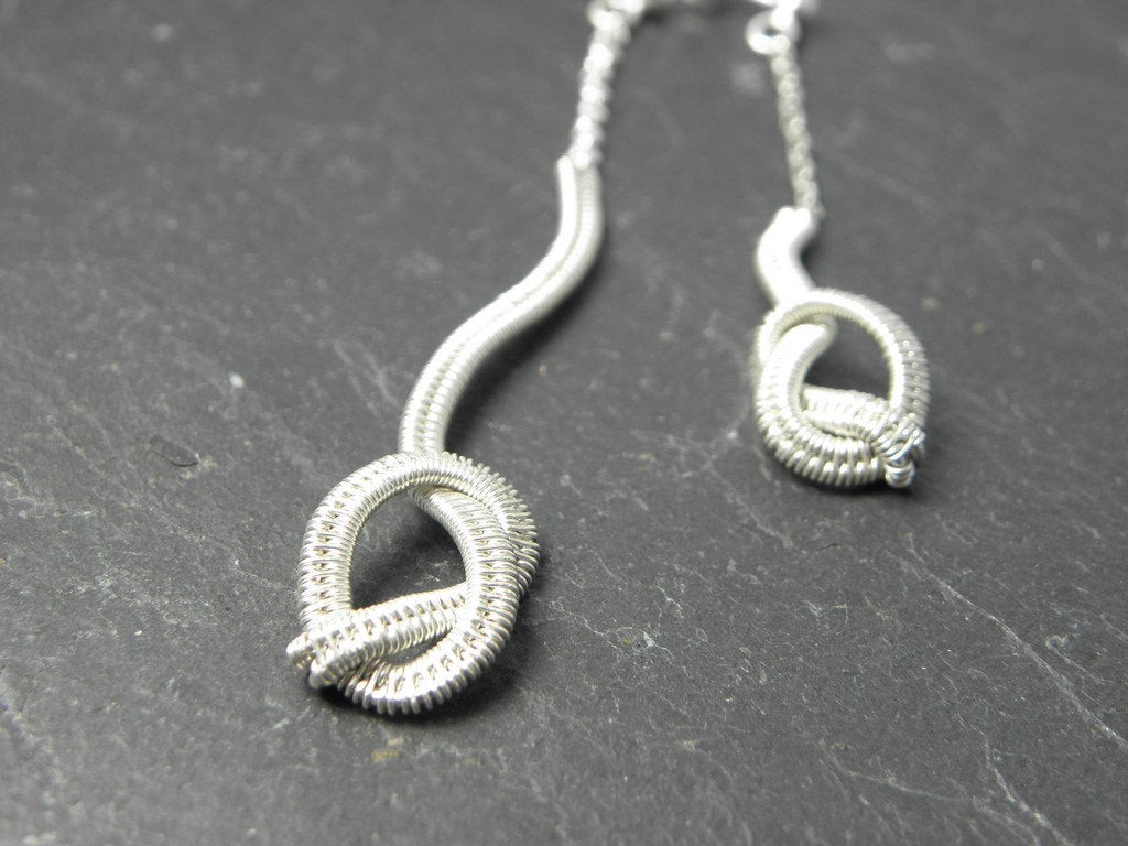 Boucles d’oreilles Nezig en Argent massif tissé.