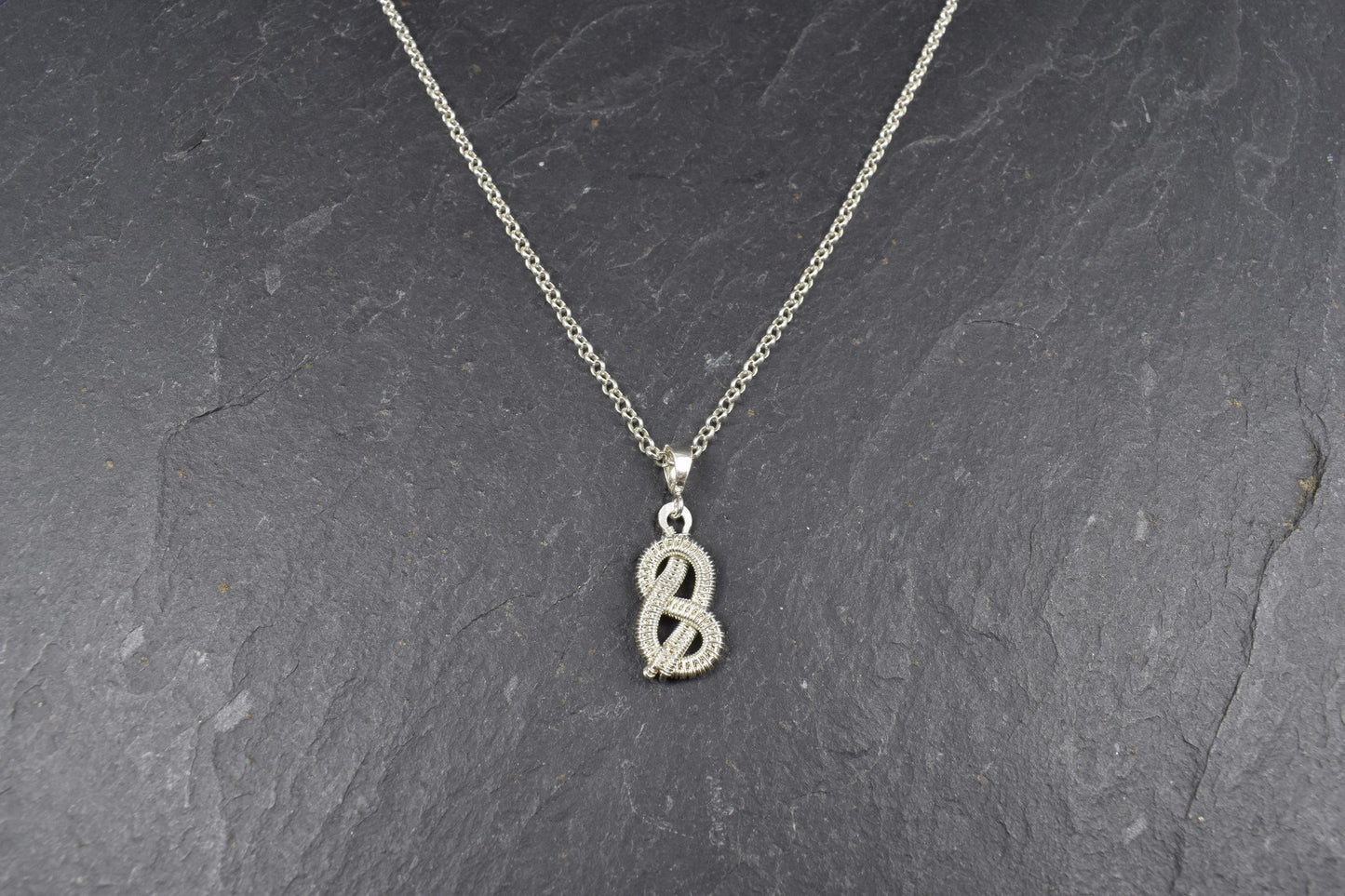 Pendentif noeud infini ou Lacs d'amour, tissé en Argent massif